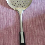 Metal slotted spoon used