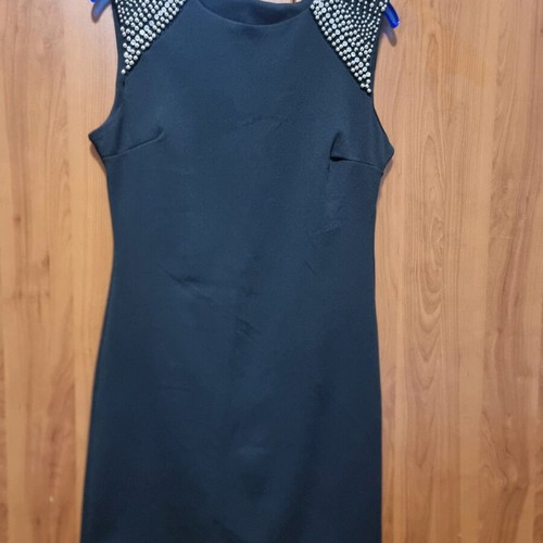 Women's black dress like new with studs on shoulders