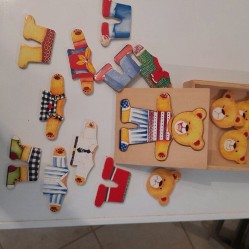 Wooden puzzle girl and bear used with pin board