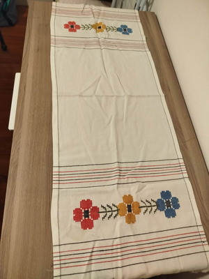 Handmade cotton table runner used with cross-stitch embroidery