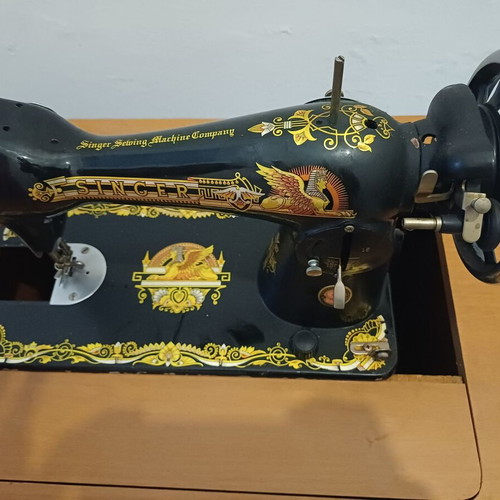 Singer sewing machine with cabinet used, motor and pedal included