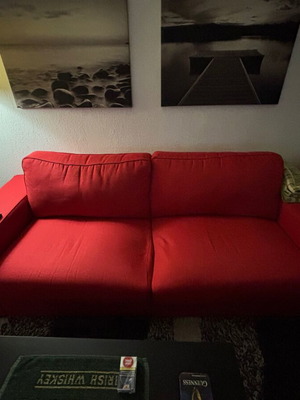 Three-seater sofa used with two extra cushions