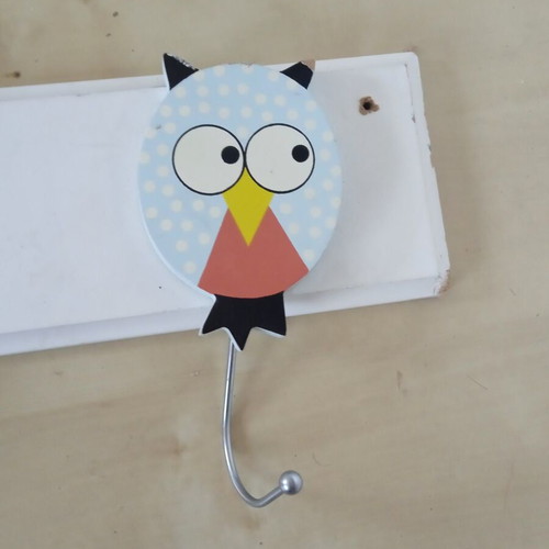 Wooden children's wall clothes hanger with three owl figures used
