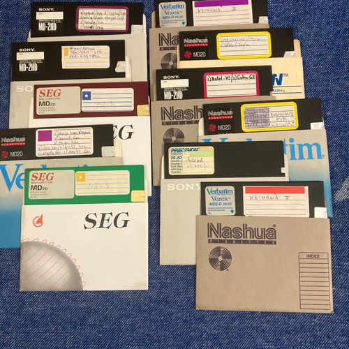 Vintage pack of used floppy disks and cassettes with 8-track and VHS