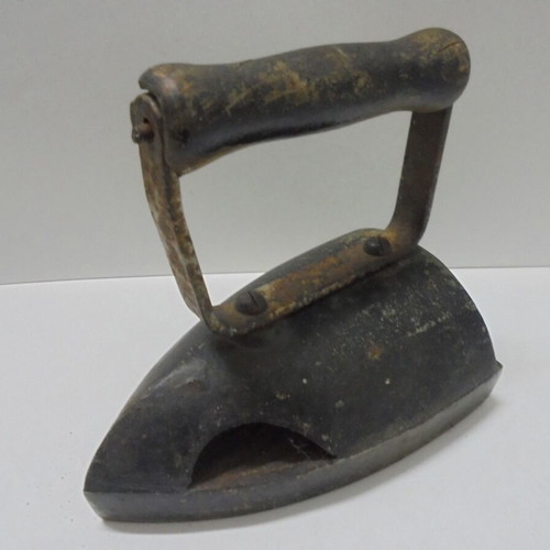 Old cast iron iron with internal heating plate used