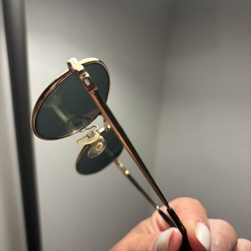 Tommy Hilfiger sunglasses with gold frame and dark lenses