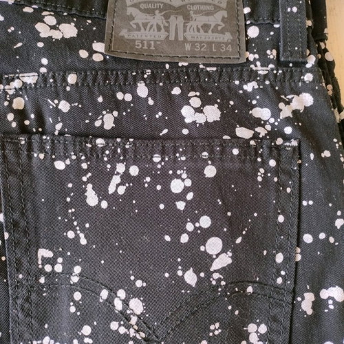 Levi's black jeans with splatter effect like new
