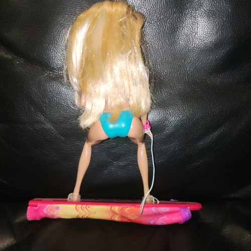 Barbie Merliah doll used with surfboard and mermaid tail