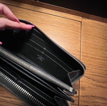 Louis Vuitton zippy leather wallet used, black with multiple card slots