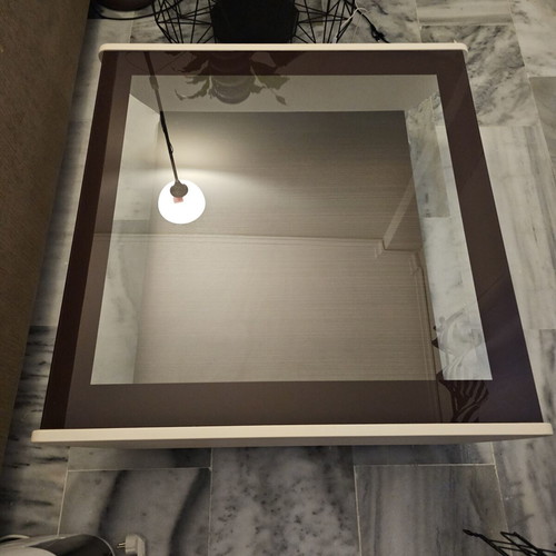 Coffee table used with glass top and storage space, brown and beige
