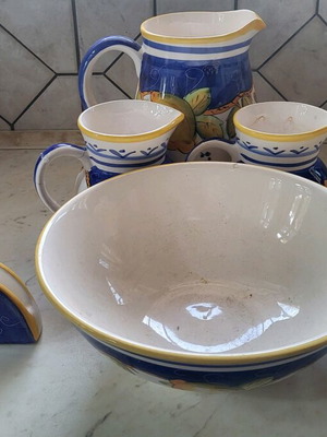 Set of jug, jars and napkin holder used
