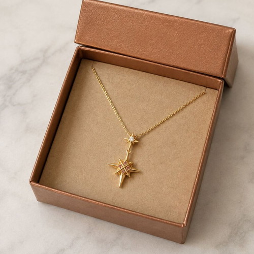 North Star gold necklace with star and pink crystals