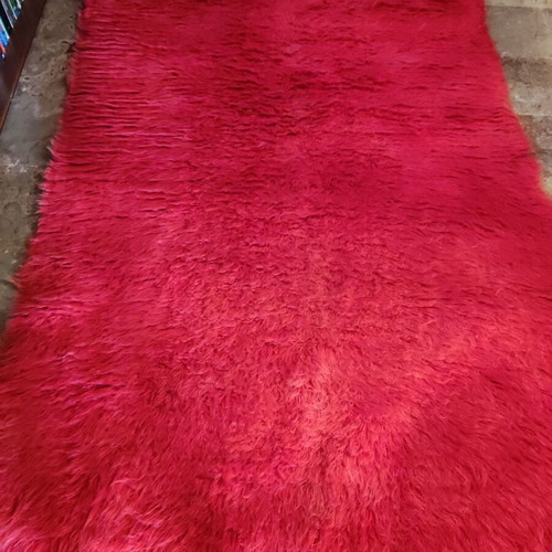 Red flokati rug used, traditional wool, approx. 230x140 cm
