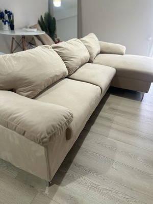 Beige corner sofa with velvet upholstery
