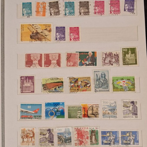 Stamp album used with 10 pages of foreign stamps 1960-1990