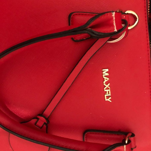 Red handbag used with wear marks
