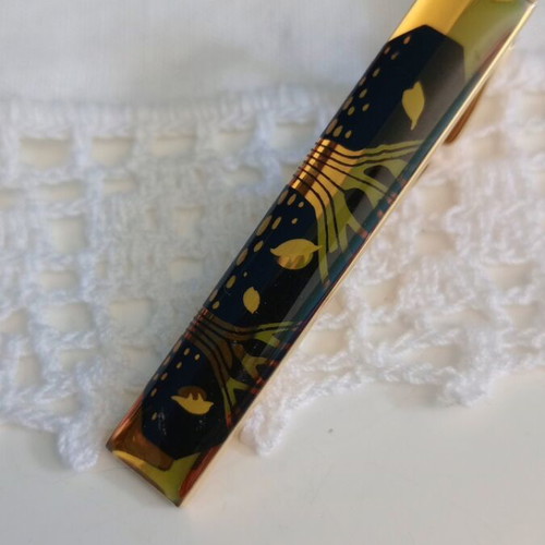 Tie Pin like new, gold and black design