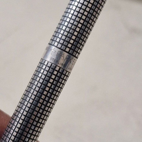 Parker pen in like new condition, possibly silver or silver-plated