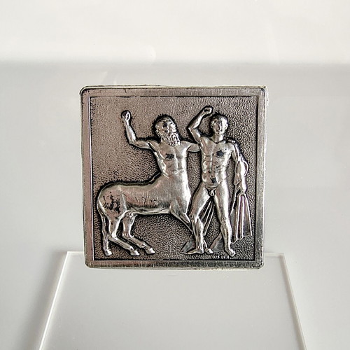 Set of 2 stands with 2 silver Parthenon sculpture depictions