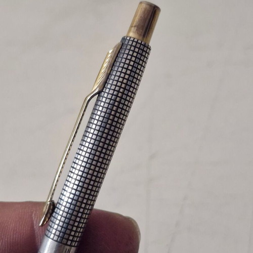 Parker pen in like new condition, possibly silver or silver-plated