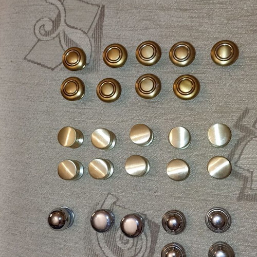 Handles and knobs for cabinets and drawers used, 24 pieces gold and silver