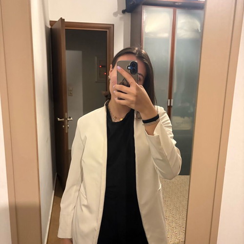 White jacket like new with shoulder pads, no pockets, belt, size M