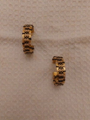 Gold earrings with black and white details like new