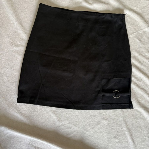 Mini black skirt with left hem detail
