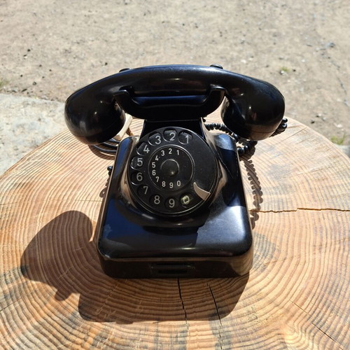 Collectible old-style telephone used, black, functional