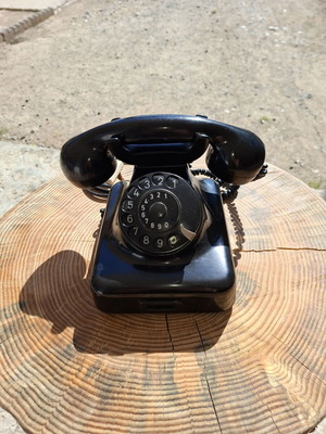 Collectible old-style telephone used, black, functional