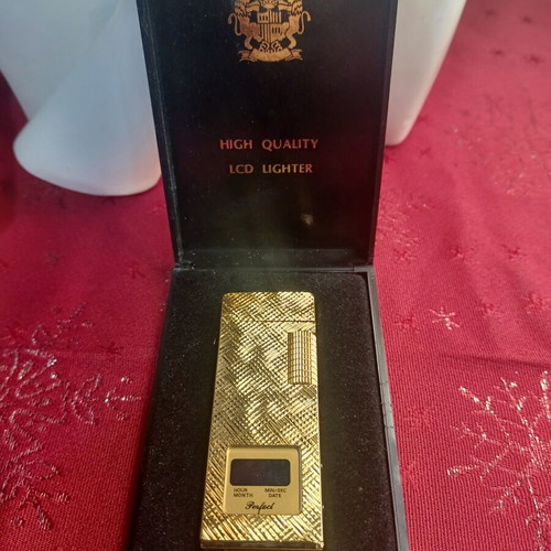Lcd Gold Lighter with Clock and Date like new