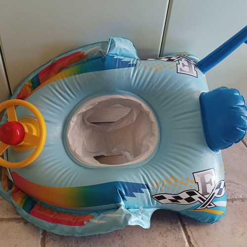 Inflatable car baby float used with leg holder