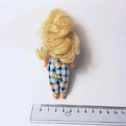 Plastic doll used with torn clothes