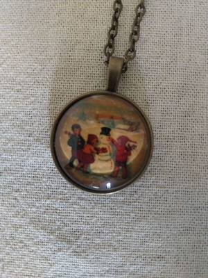 Vintage long necklace with snowman and children, like new