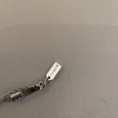 Coach pendant like new, silver color, stylish