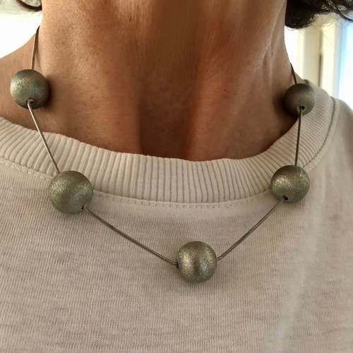 Snake chain necklace used with 5 hammered metal balls