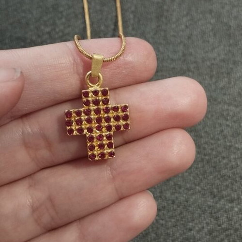 Necklace with gold color cross pendant and red rhinestones like new