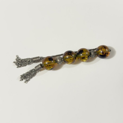 Worry beads used with amber-style beads and metal details