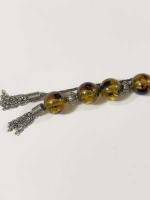 Worry beads used with amber-style beads and metal details