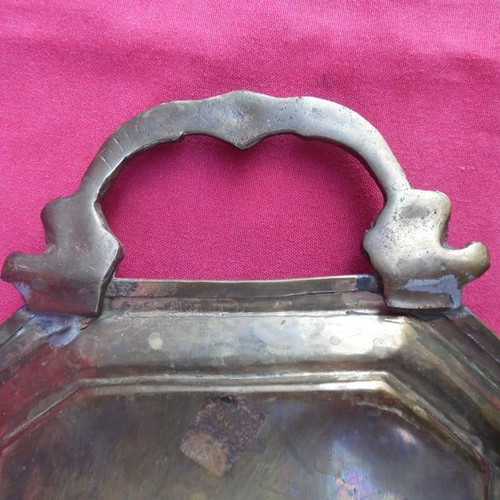Handmade brass tray used with carved handles