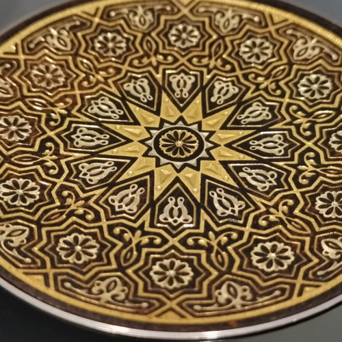 Set of three used metal candle holders with Arabic designs