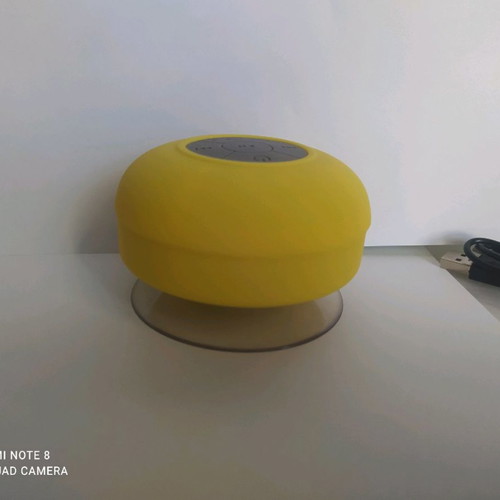 Bluetooth waterproof speaker yellow with detachable suction cup and charging cable