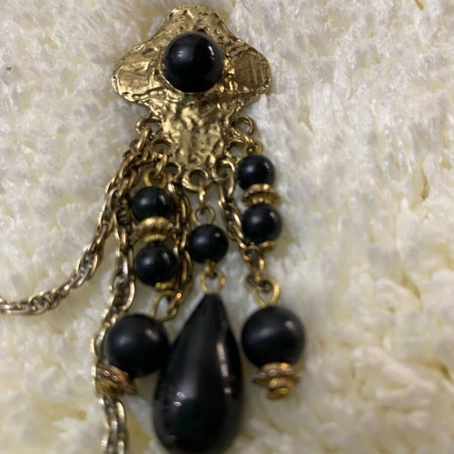 Vintage double brooch like new, gold color with black stones