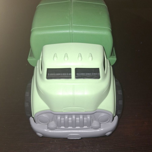 Green toy truck with opening feature