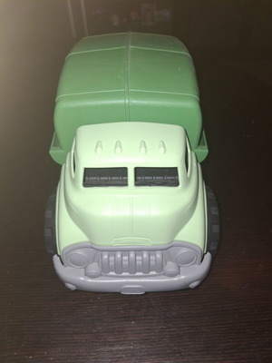 Green toy truck with opening feature