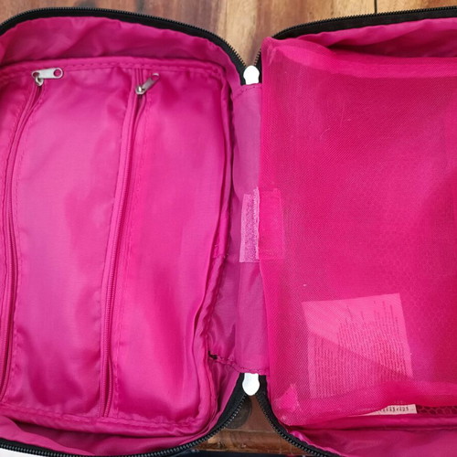 Avon cosmetic bag used, black and pink, collector's edition