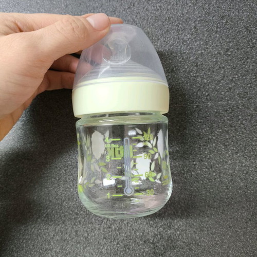 Small glass baby bottle like new with temperature indicator