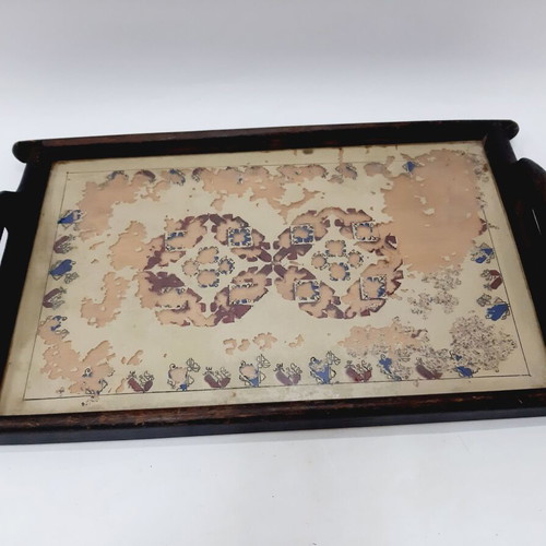 Vintage wooden tray with glass panel and painted design used
