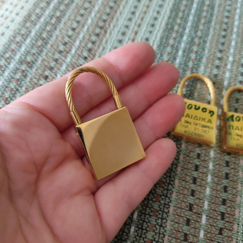 Keychains set of 3 used, gold tone, promotional children's clothing