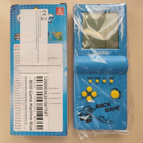 Vintage Tetris handheld game from the 90s, blue, new